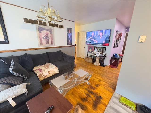 2515 Countess Dr, Saint Louis, MO 63136 - living area featuring a chandelier and wood finished floors