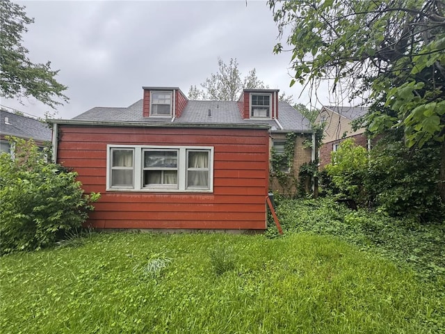206 Thoroughman Ave, Ferguson, MO 63135 - view of property exterior featuring a lawn
