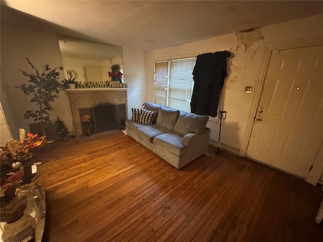 206 Thoroughman Ave, Ferguson, MO 63135 - living area featuring hardwood / wood-style flooring and a brick fireplace