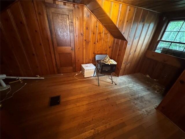 206 Thoroughman Ave, Ferguson, MO 63135 - additional living space featuring hardwood / wood-style flooring and wood walls