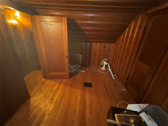 206 Thoroughman Ave, Ferguson, MO 63135 - bonus room featuring hardwood / wood-style floors, wood walls, and vaulted ceiling