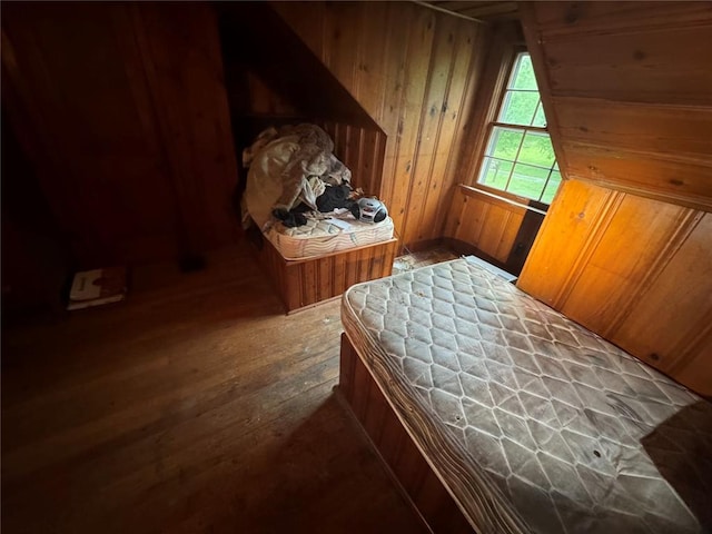 206 Thoroughman Ave, Ferguson, MO 63135 - bedroom with wood walls and wood-type flooring