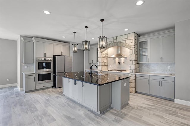535 Crail Ct, Ofallon, MO 63368 - kitchen featuring appliances with stainless steel finishes, gray cabinets, wall chimney exhaust hood, and recessed lighting