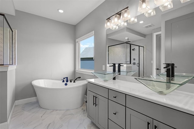 535 Crail Ct, Ofallon, MO 63368 - bathroom featuring a stall shower, double vanity, marble look tiles, a soaking tub, and baseboards