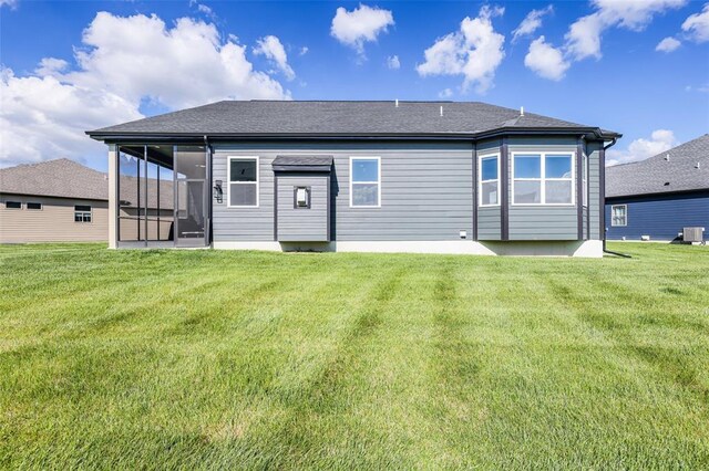 535 Crail Ct, Ofallon, MO 63368 - rear view of house with a lawn and a sunroom