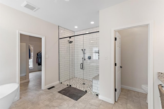 bathroom featuring a shower stall, baseboards, toilet, recessed lighting, and tile patterned floors