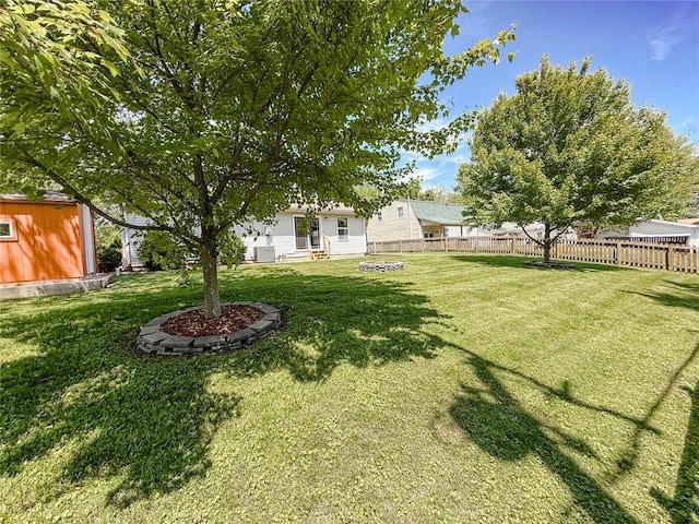 222 Elm Dr, Fairview Heights, IL 62208 - view of yard featuring a shed, an outbuilding, central air condition unit, and entry steps