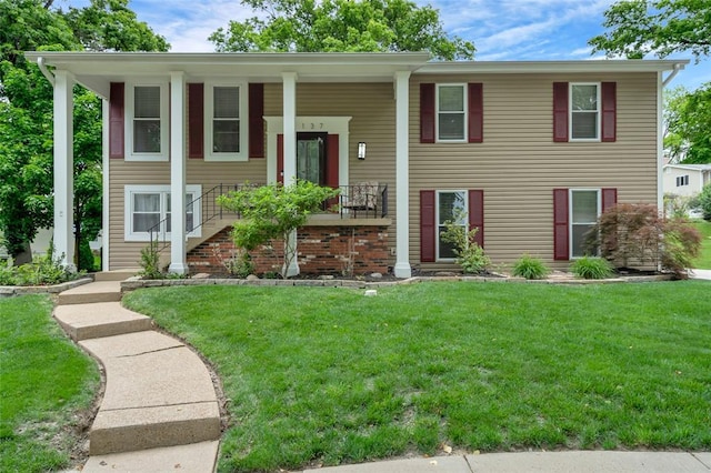 1137 Great Falls Ct, Manchester, MO 63021 - raised ranch with a front lawn and a porch