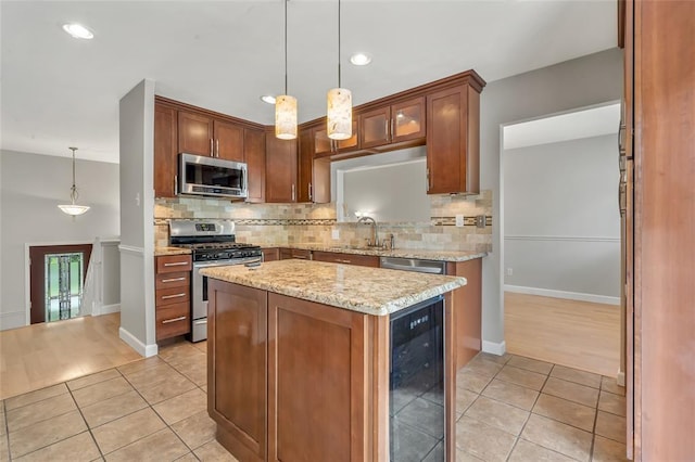 1137 Great Falls Ct, Manchester, MO 63021 - kitchen with appliances with stainless steel finishes, wine cooler, light tile patterned floors, a sink, and recessed lighting
