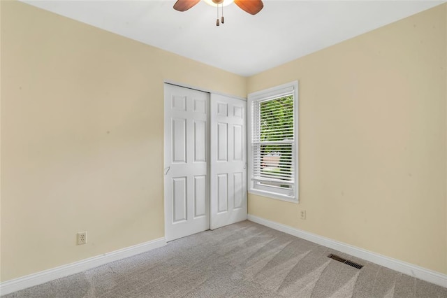 1137 Great Falls Ct, Manchester, MO 63021 - unfurnished bedroom featuring baseboards, carpet, a closet, and a ceiling fan