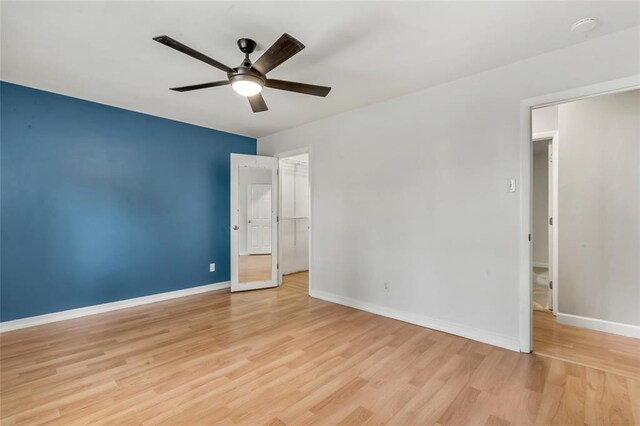 1137 Great Falls Ct, Manchester, MO 63021 - unfurnished bedroom featuring light wood-style floors, baseboards, and a ceiling fan