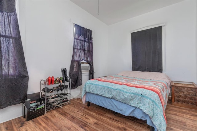 bedroom with wood finished floors