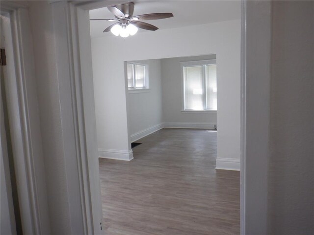5335 Bancroft Ave, Saint Louis, MO 63109 - unfurnished room with baseboards, a ceiling fan, and wood finished floors