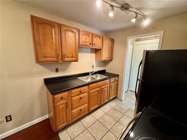 624 Coeur De Royale Dr Unit A, Creve Coeur, MO 63141 - kitchen with a sink, dark countertops, freestanding refrigerator, electric range, and baseboards