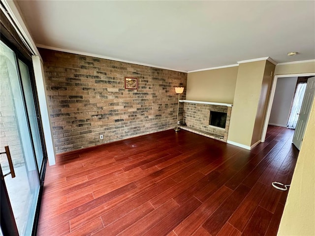 624 Coeur De Royale Dr Unit A, Creve Coeur, MO 63141 - unfurnished living room featuring brick wall, a fireplace, wood finished floors, crown molding, and baseboards