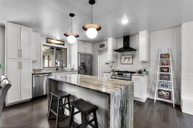 1719 Oak Hills St, Cape Girardeau, MO 63701 - kitchen with appliances with stainless steel finishes, wall chimney range hood, a sink, dark wood-style flooring, and recessed lighting