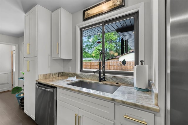 1719 Oak Hills St, Cape Girardeau, MO 63701 - kitchen featuring appliances with stainless steel finishes, a sink, healthy amount of natural light, and light stone counters