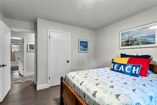 1719 Oak Hills St, Cape Girardeau, MO 63701 - bedroom with dark wood-style floors and baseboards