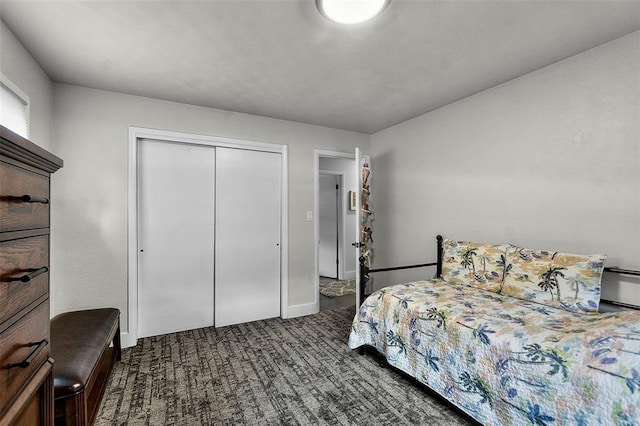 1719 Oak Hills St, Cape Girardeau, MO 63701 - bedroom with dark carpet, a closet, and baseboards