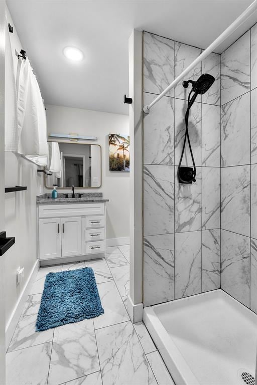 1719 Oak Hills St, Cape Girardeau, MO 63701 - bathroom featuring vanity, marble look tile flooring, baseboards, tiled shower, and recessed lighting