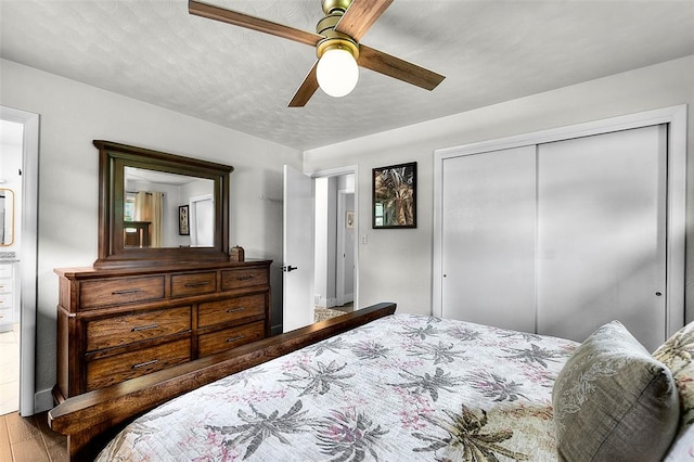 1719 Oak Hills St, Cape Girardeau, MO 63701 - bedroom with a closet, wood finished floors, and a ceiling fan