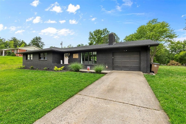 1719 Oak Hills St, Cape Girardeau, MO 63701 - view of front facade featuring a garage, brick siding, a front lawn, and driveway