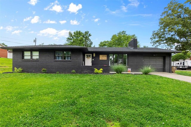 1719 Oak Hills St, Cape Girardeau, MO 63701 - ranch-style home featuring a garage, driveway, brick siding, a chimney, and a front yard