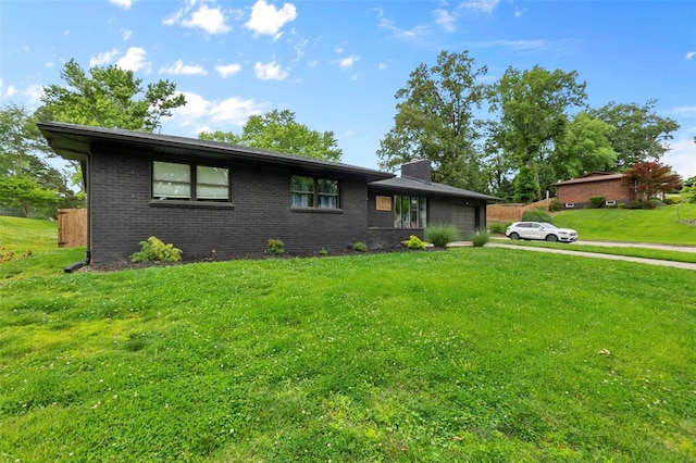 1719 Oak Hills St, Cape Girardeau, MO 63701 - view of front of property with a garage, a chimney, brick siding, and a front yard