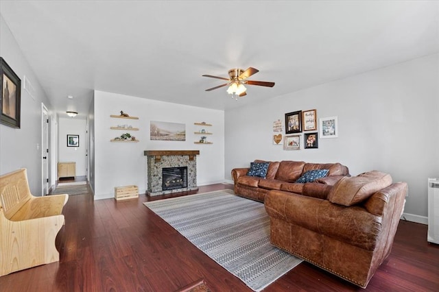 15 W 13th St, Washington, MO 63090 - living room with ceiling fan, wood finished floors, a fireplace, and baseboards