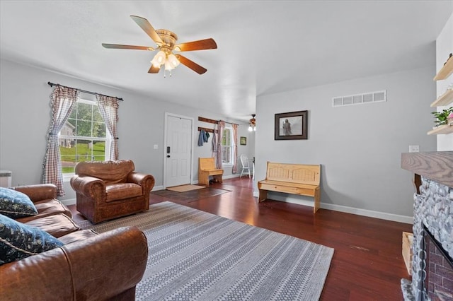 15 W 13th St, Washington, MO 63090 - living area with ceiling fan, wood finished floors, baseboards, and a stone fireplace