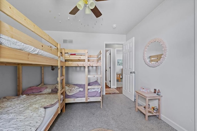 15 W 13th St, Washington, MO 63090 - carpeted bedroom featuring baseboards and a ceiling fan