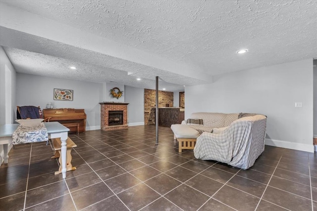 15 W 13th St, Washington, MO 63090 - living room with a brick fireplace, a textured ceiling, recessed lighting, tile patterned floors, and baseboards