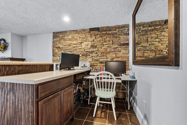 15 W 13th St, Washington, MO 63090 - office area featuring a textured ceiling and dark tile patterned floors