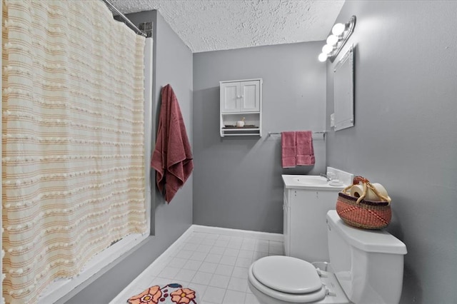 15 W 13th St, Washington, MO 63090 - bathroom featuring toilet, a textured ceiling, tile patterned flooring, vanity, and baseboards