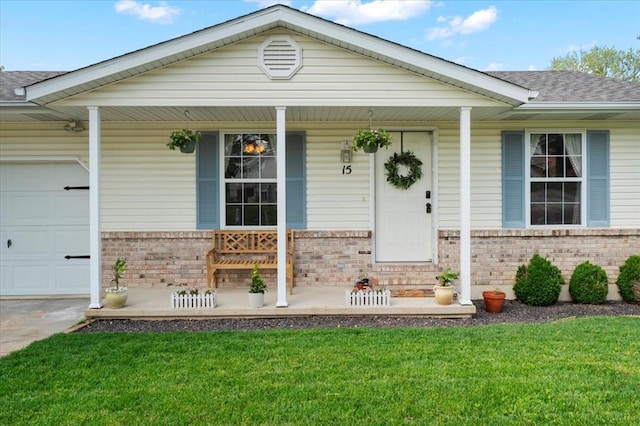 15 W 13th St, Washington, MO 63090 - view of front of property featuring brick siding, covered porch, an attached garage, a front yard, and a shingled roof