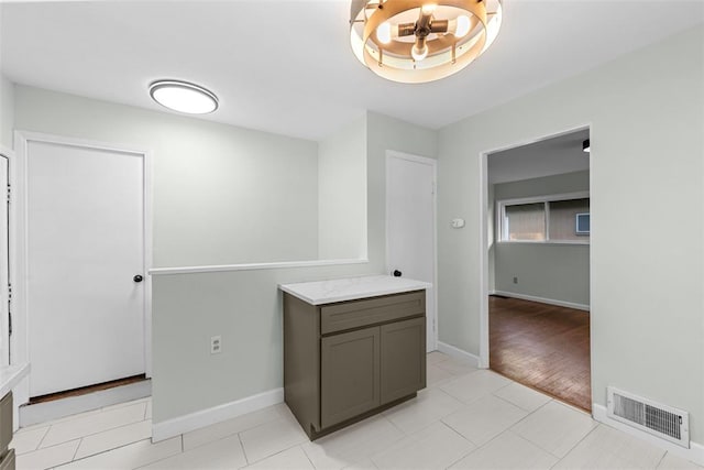 interior space with baseboards and vanity