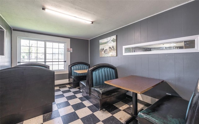 108 College Ave, Licking, MO 65542 - dining area with tile patterned floors and a textured ceiling