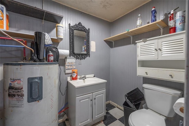 108 College Ave, Licking, MO 65542 - half bathroom with electric water heater, tile patterned floors, vanity, toilet, and baseboards