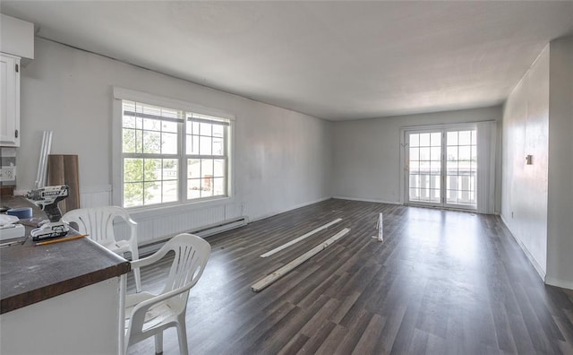 108 College Ave, Licking, MO 65542 - unfurnished living room featuring dark wood-style floors and baseboards