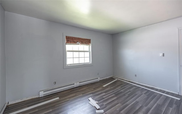 108 College Ave, Licking, MO 65542 - unfurnished room featuring a baseboard radiator and wood finished floors