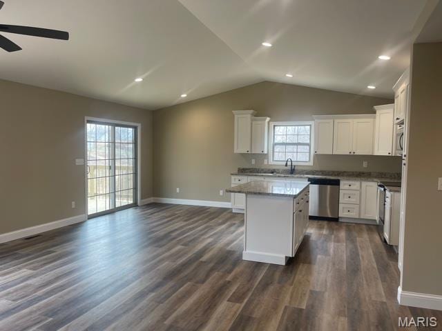 289 Broch Tuarach Pl, Jackson, MO 63755 - kitchen featuring dishwasher, a ceiling fan, open floor plan, baseboards, and vaulted ceiling