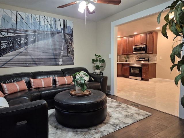 9643 Holtwood Rd, Overland, MO 63114 - living room featuring a ceiling fan, light wood-type flooring, recessed lighting, and baseboards