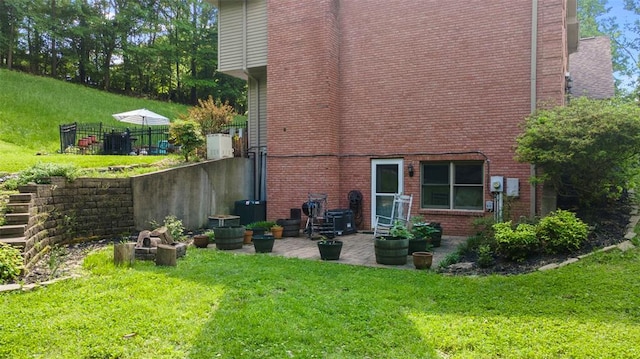 1711 El Rio Dr, Cape Girardeau, MO 63701 - rear view of property with brick siding and a patio area