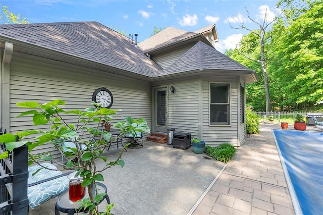 1711 El Rio Dr, Cape Girardeau, MO 63701 - rear view of property with roof with shingles, a patio area, and fence