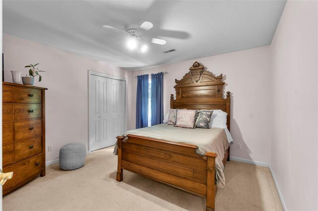 1711 El Rio Dr, Cape Girardeau, MO 63701 - bedroom featuring light carpet, a closet, a ceiling fan, and baseboards