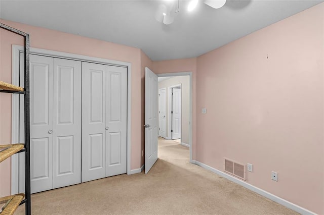 1711 El Rio Dr, Cape Girardeau, MO 63701 - unfurnished bedroom featuring light carpet, baseboards, a closet, and ceiling fan