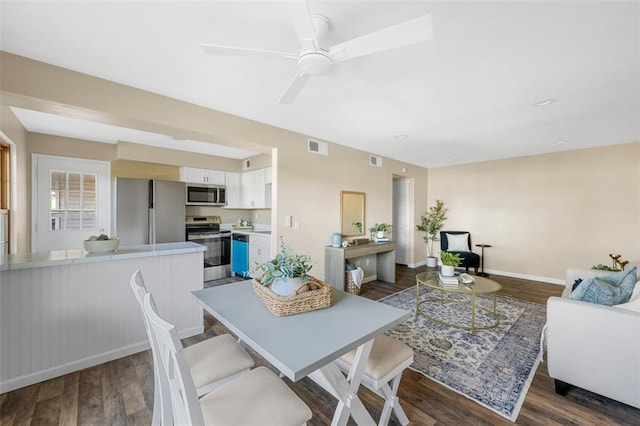 853 Dumont Pl Unit A, Saint Louis, MO 63125 - dining space featuring a ceiling fan, dark wood finished floors, and baseboards