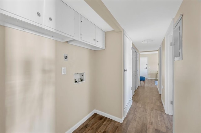 853 Dumont Pl Unit A, Saint Louis, MO 63125 - laundry room with cabinet space, washer hookup, light wood-style floors, baseboards, and electric dryer hookup