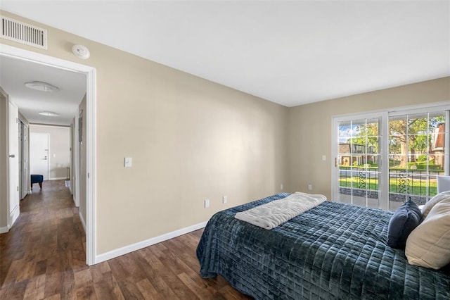 853 Dumont Pl Unit A, Saint Louis, MO 63125 - bedroom with wood finished floors, baseboards, and access to exterior