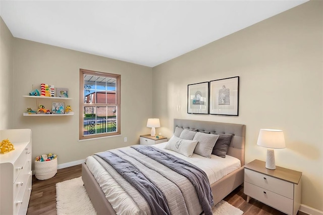 853 Dumont Pl Unit A, Saint Louis, MO 63125 - bedroom featuring baseboards and dark wood finished floors